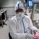 A laboratory operator wearing protective gear in France. The country reported the first death due to coronavirus, or COVID-19, outside Asia.